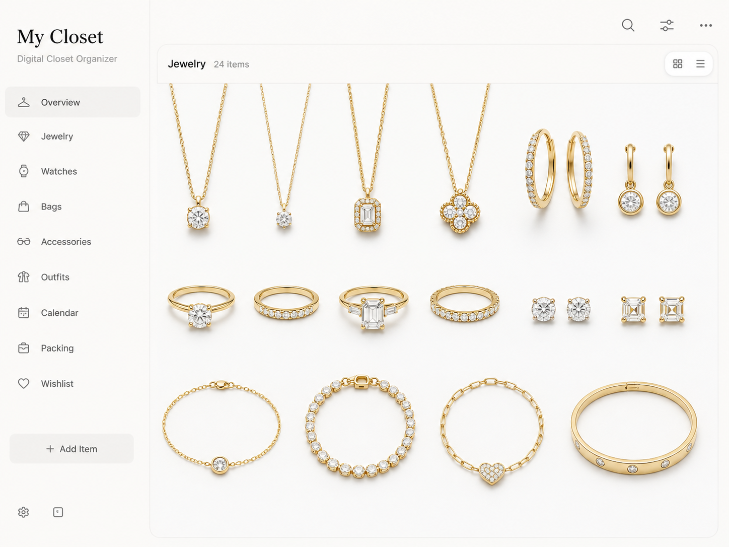 Digital closet organizer - yellow gold and diamond jewelry laid out on a clean white background for scanning